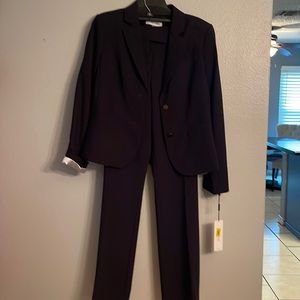 Women’s suit jacket and button pants, size 12 jacket and 10 pants.